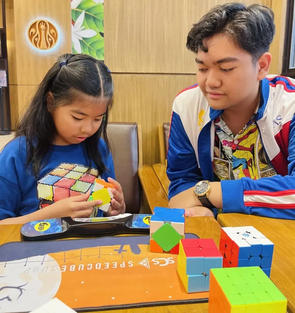 Students learning how to cube